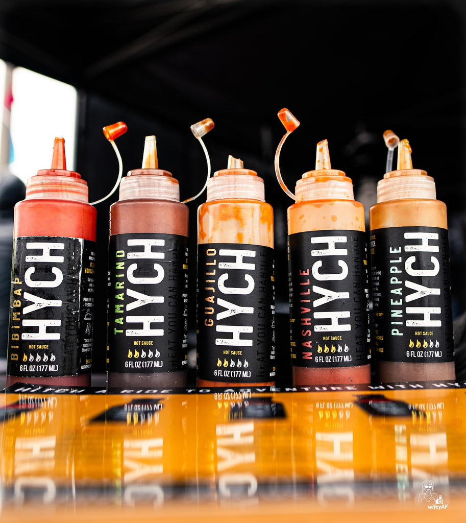 HYCH Hot Sauces all five flavors in plastic squeeze bottles on display