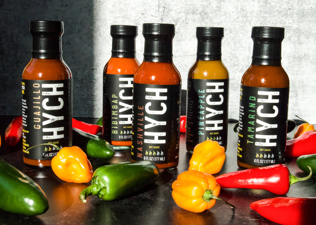 HYCH hot sauces with chili peppers
